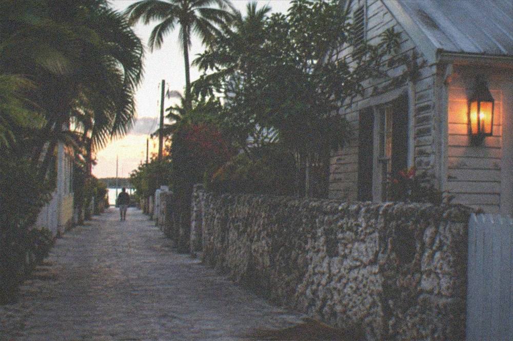 Quiet candlelit lane in Old Town Key West on a calm dry-season evening